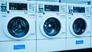 A front-load washing machine in a home laundry room