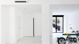 Garage door opener motor unit mounted to the ceiling of a home garage