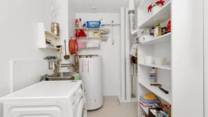 A residential gas furnace installed in a basement utility room